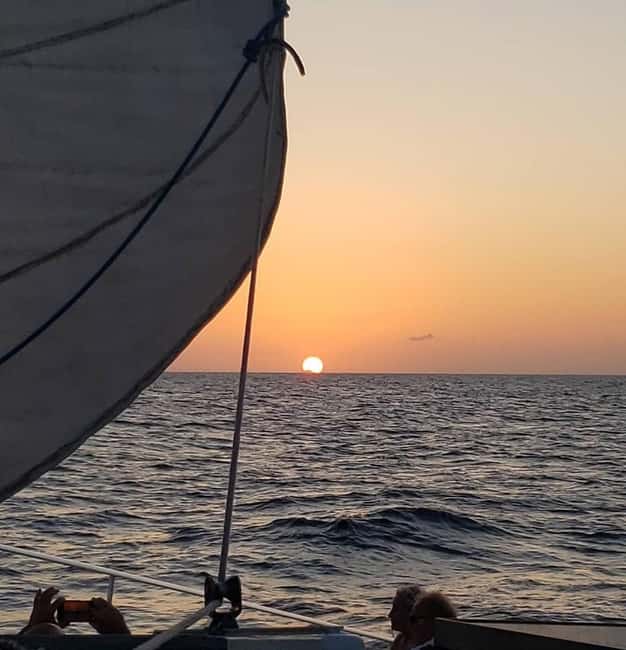Sunset Cruise In Paradise - Raising the sail around Paradise Island